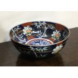A Chinese Imari bowl decorated with dragons. Est.