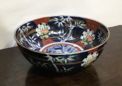 A Chinese Imari bowl decorated with dragons. Est.