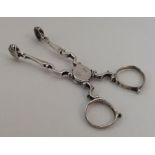 A heavy pair of Georgian silver sugar scissors. Pu