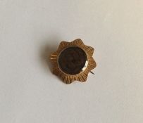 A Georgian gold mourning brooch decorated with hai