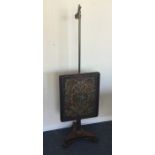 A Victorian pole screen with tapestry front. Est.