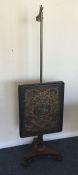 A Victorian pole screen with tapestry front. Est.