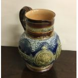 A Doulton Lambeth baluster shaped jug on spreading