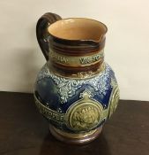 A Doulton Lambeth baluster shaped jug on spreading