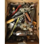 A box of woodworking planes and files.