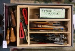 A box containing chisels, brushes etc.