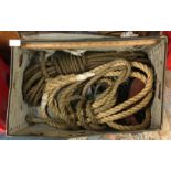 A box containing old ropes and pulleys.