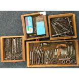 Four drawers of drill pieces.