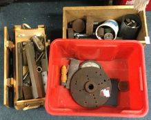 A box containing lathe mounts.