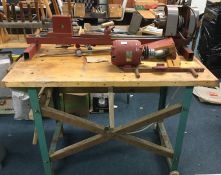 An old electric lathe on stand.