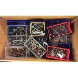 A box containing bolts and fixings.