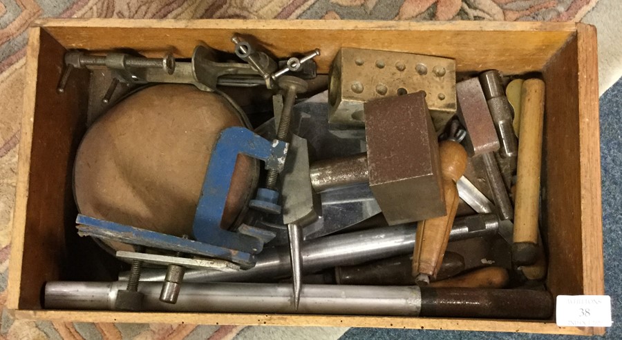 A tray containing clamps etc.