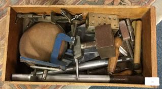 A tray containing clamps etc.