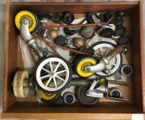 A box containing trolley wheels etc.