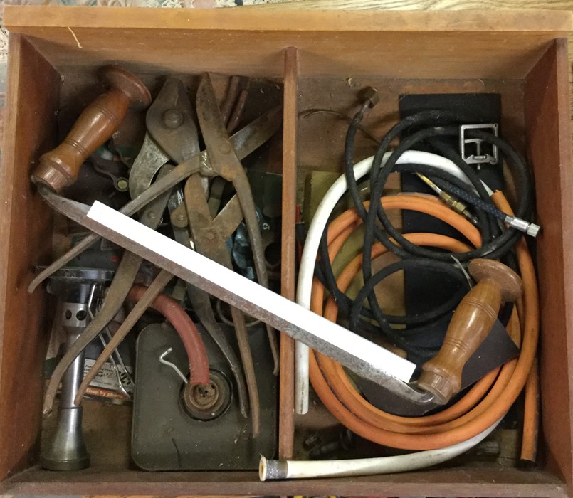 A box containing metal scissors etc.