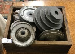 A box containing belt pulleys.