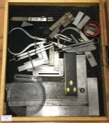 A tray containing clamps and measures.