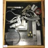 A tray containing clamps and measures.
