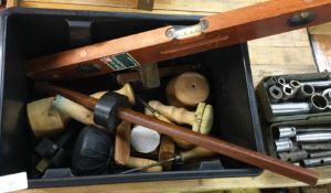 A box containing spirit levels, measures etc.