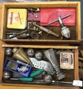 A box containing punches and measures.