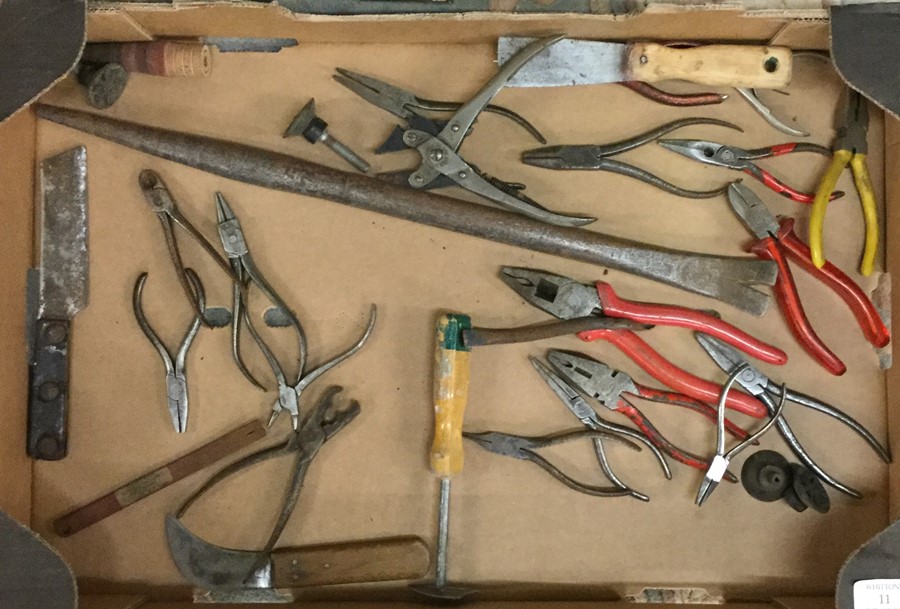 A box containing pliers and wire cutters.
