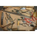 A box containing pliers and wire cutters.