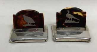 A pair of attractive tortoiseshell and silver menu