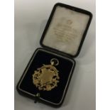 A cased silver gilt medallion. Approx. 14 grams. E
