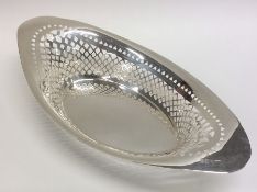 An Edwardian silver engraved basket of boat shaped