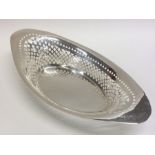 An Edwardian silver engraved basket of boat shaped