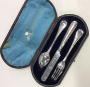 A cased three piece silver christening set. Sheffi