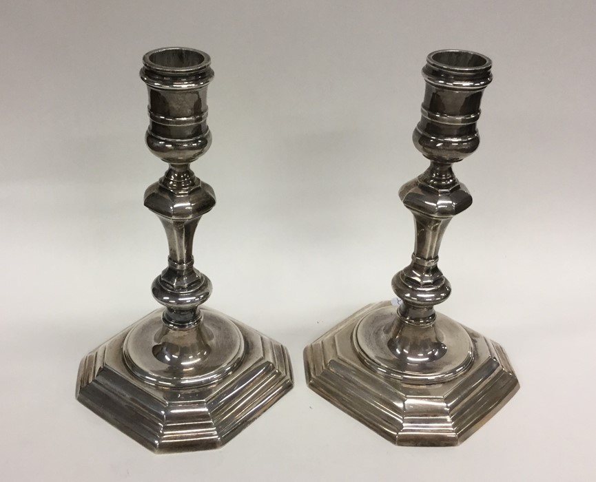 A good pair of cast silver Georgian style candlest