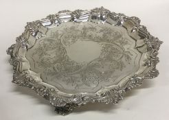 A large Georgian silver salver decorated with flow