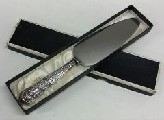 A silver handled cake knife. Sheffield. By Viners.