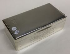 A heavy silver engine turned silver cigarette box.