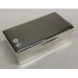 A heavy silver engine turned silver cigarette box.