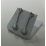 A pair of silver mounted and paste tear shaped dro