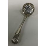 A Kings' pattern silver sifter spoon. London. Appr