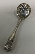 A Kings' pattern silver sifter spoon. London. Appr