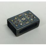 A Russian silver and enamelled matchbox case decor