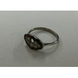 An 18 carat and platinum mounted ring inset with d