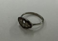 An 18 carat and platinum mounted ring inset with d