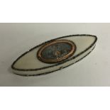 A Georgian boat shaped ivory needle case with oval