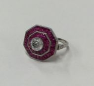 A large brilliant cut single stone ring with ruby