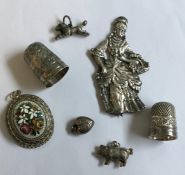 Two silver thimbles together with silver fobs etc.