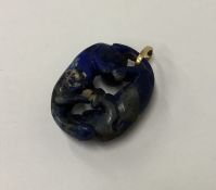 An unusual Chinese lapis carving mounted as a pend