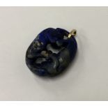 An unusual Chinese lapis carving mounted as a pend