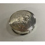 A circular Art Nouveau round silver pin box decora