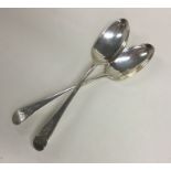 A pair of Georgian silver bright cut dessert spoon