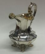 A large good quality cast silver cream jug with gi